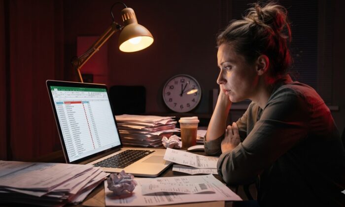 small business owner stressed about being behind on bookkeeping